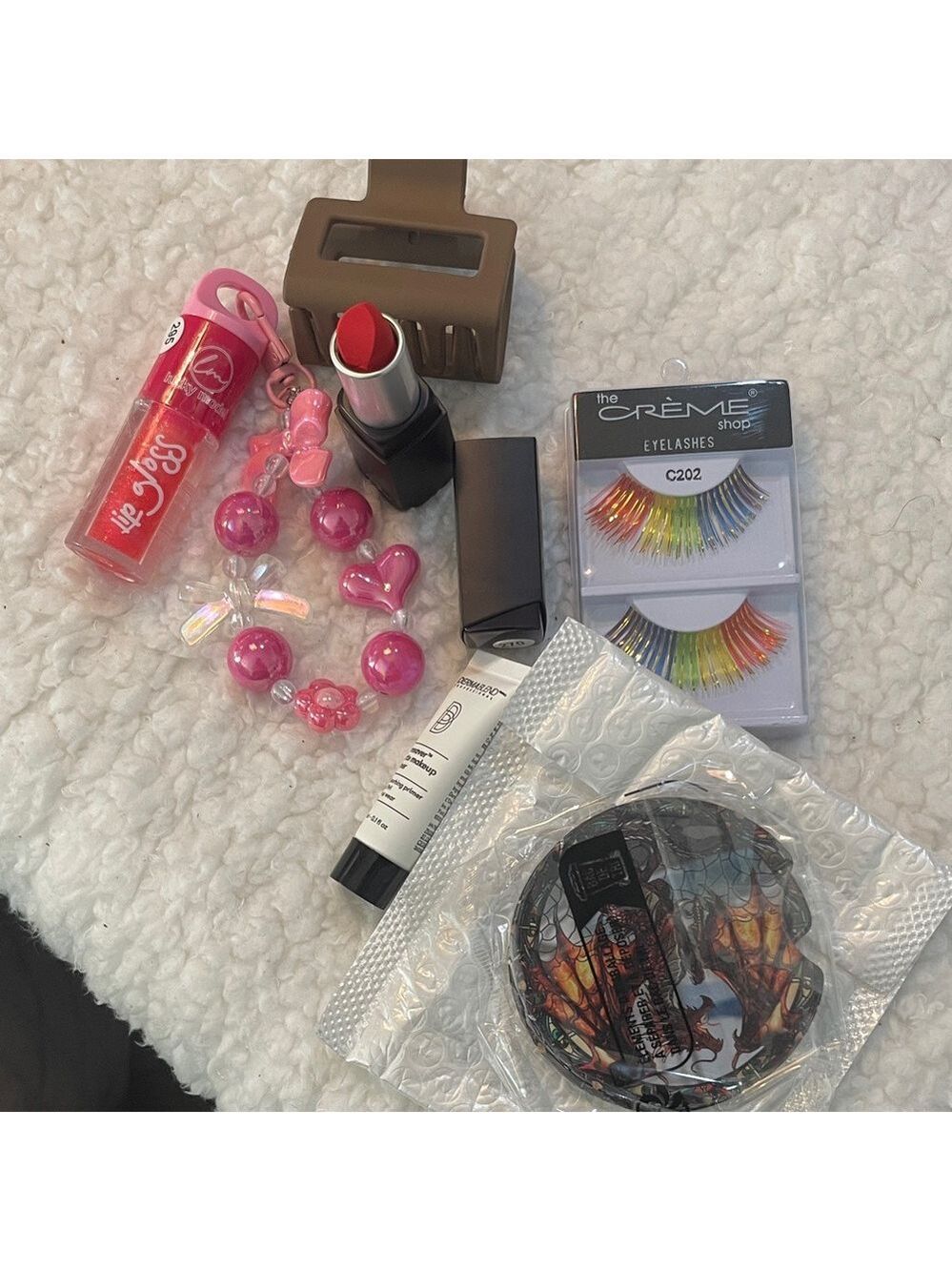 Red Lipstick with a bundle of products: stocking stuffers